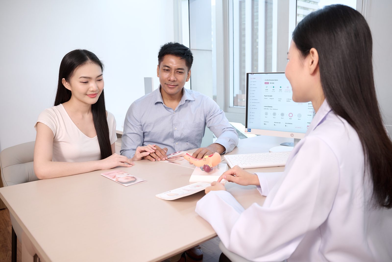 A couple in consultation with a fertility specialist at Angel Baby IVF Clinic, Bangkok