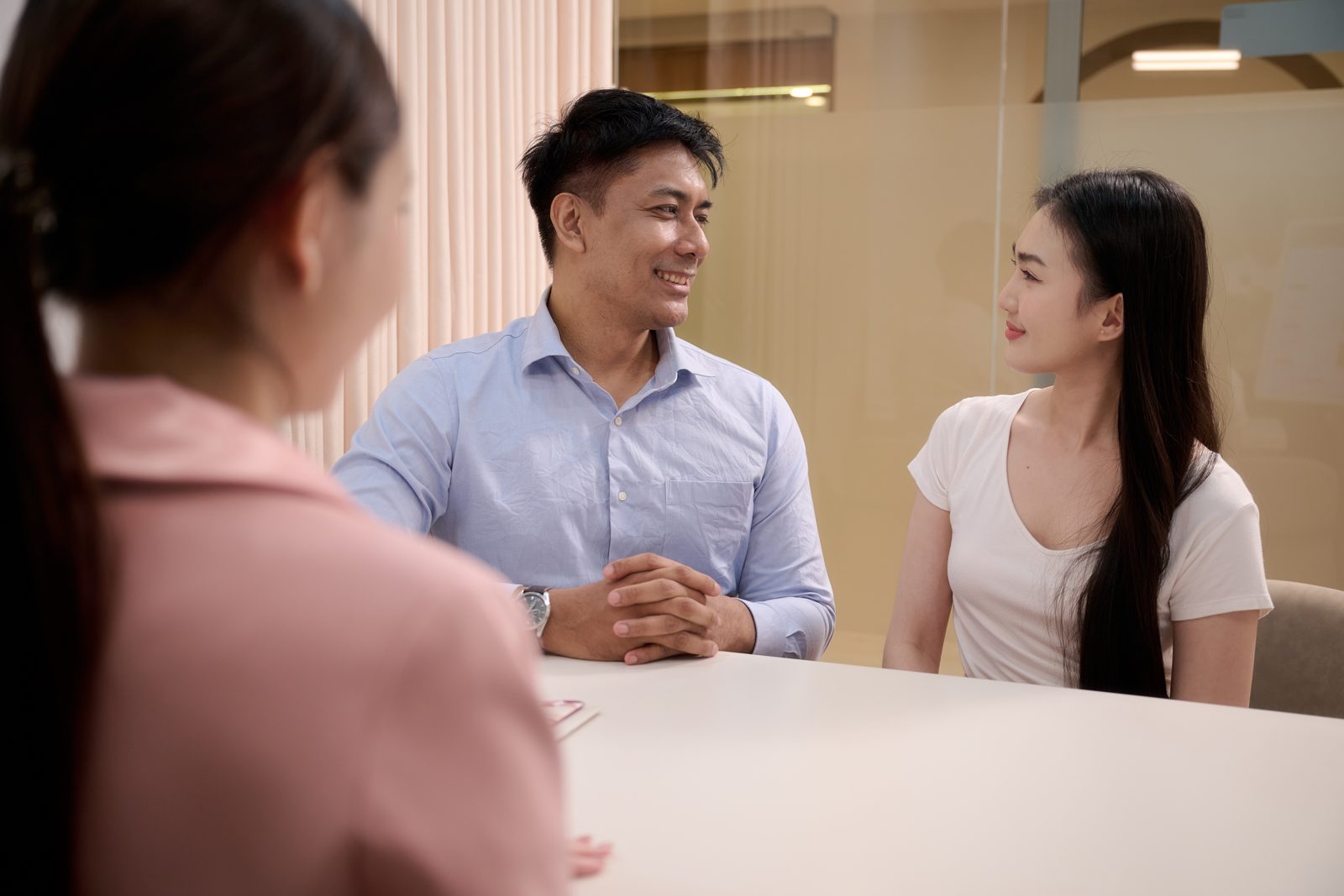 A couple discussing the timing of their embryo transfer with the clinical team